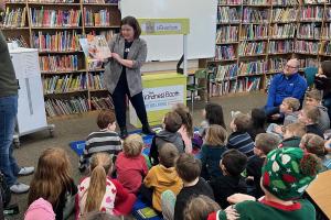 Laura reading to first graders